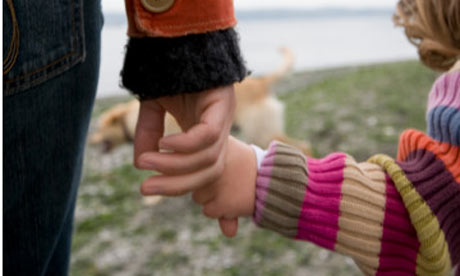 Mother-holding-childs-han-001